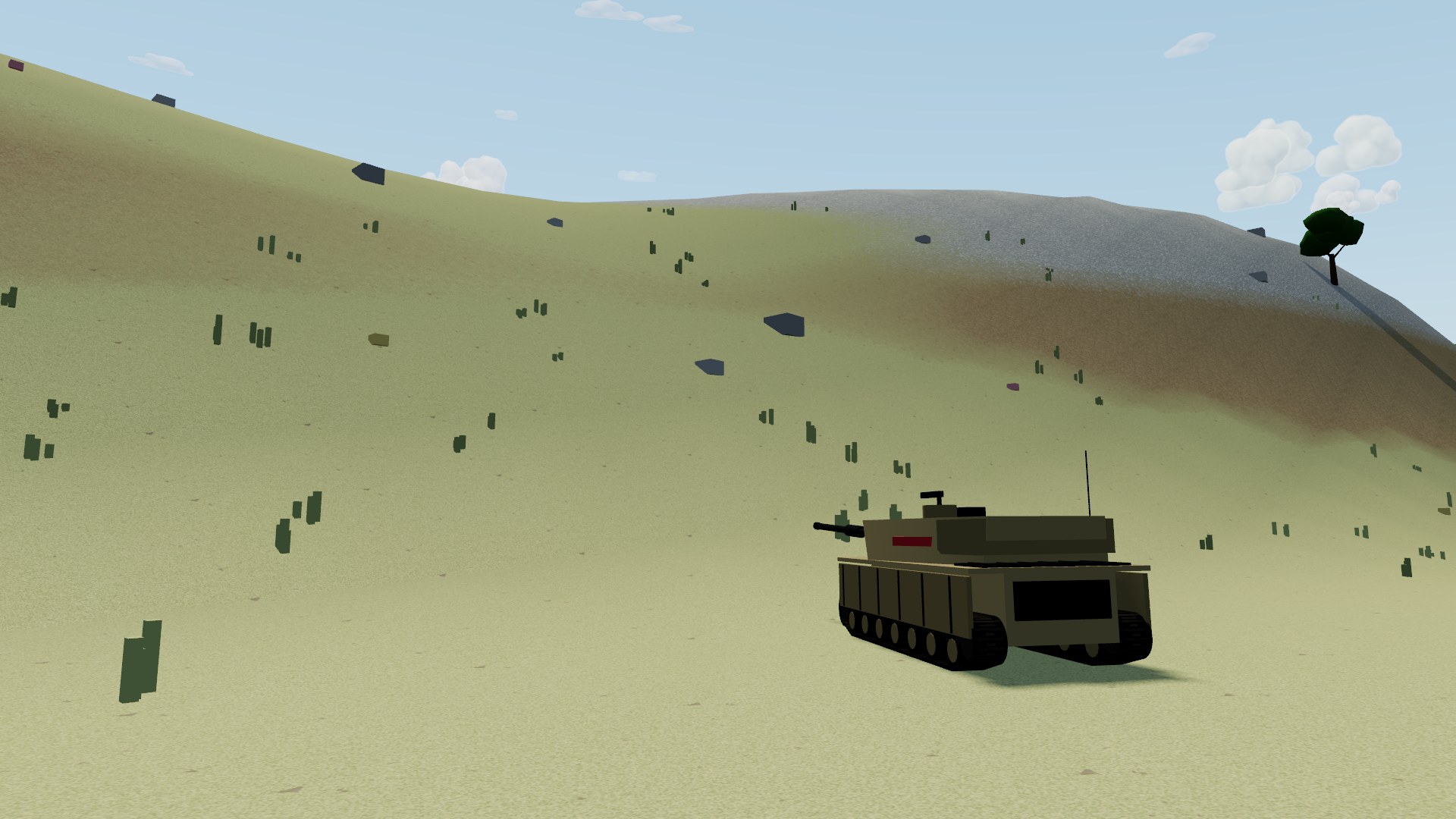 A tank climbing a smooth grassy rise on the steppe, tufts of tall grass and half-buried boulders on the slope, bare earth and stone on the crest above